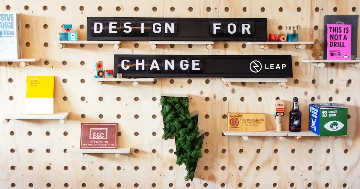 Design for Change board and awards on the peg wall at the Leap office